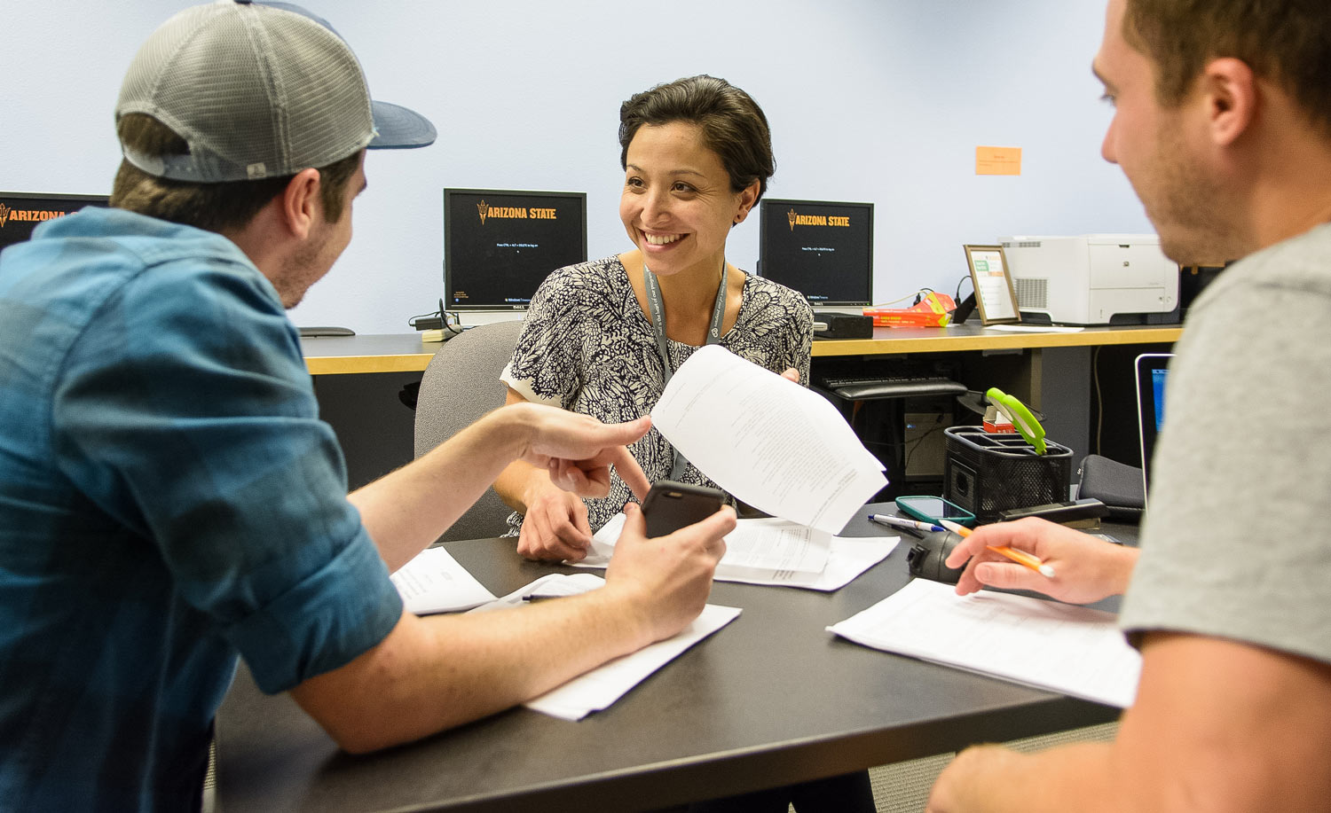 An advisor explains the sustainable management degree to students interested in executive education.