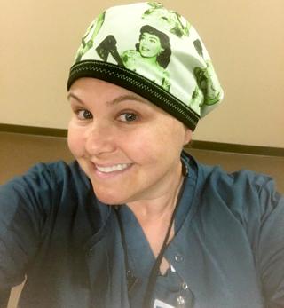 Jennifer Johnson wearing scrubs and surgical hat.