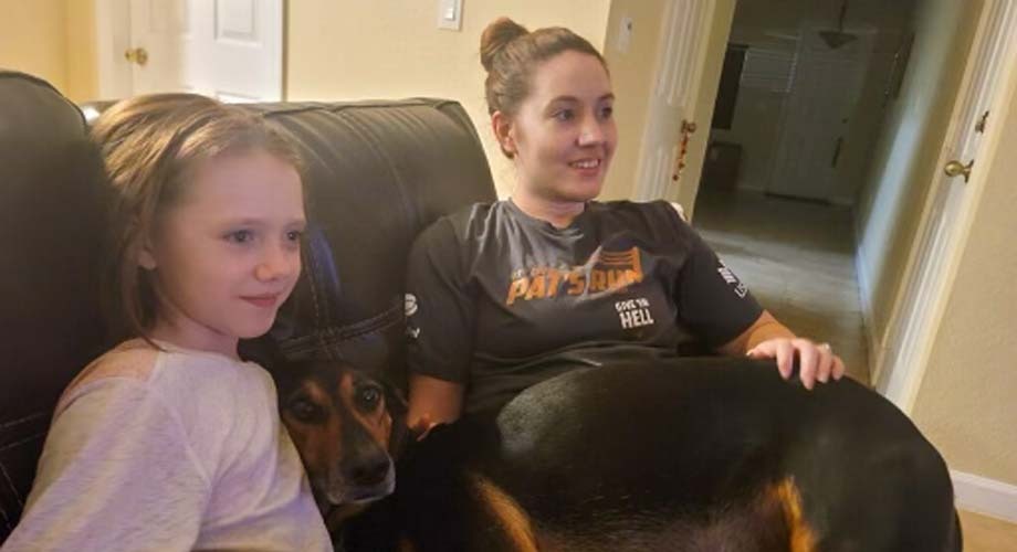 ASU Online student Lauren enjoying self-care and downtime at home with her daughter and dog.