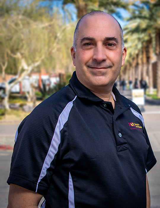 ASU professor Mike Angilletta poses for a picture outside on the ASU campus.