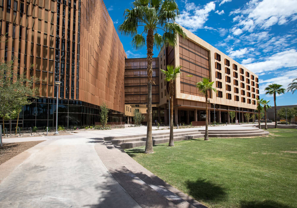 A tan and brown multi-floor housing building at ASU.