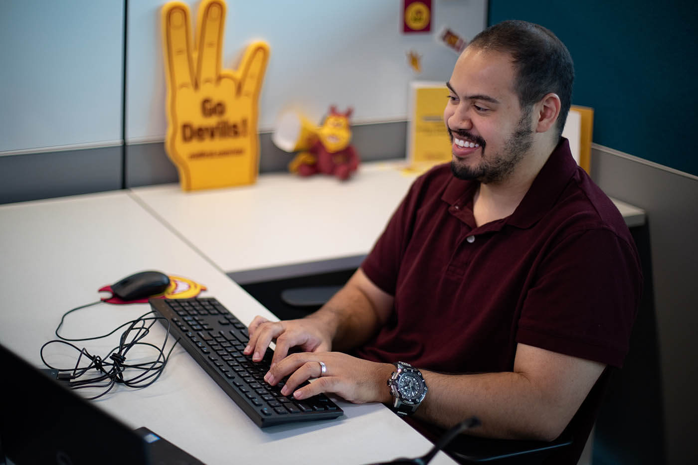 Arizona State University enrollment coach smiling and engaging with a student virtually.