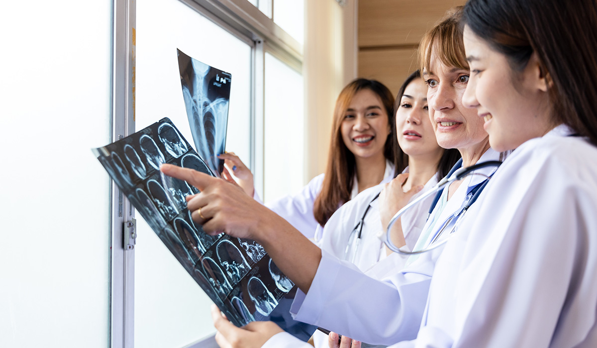 A nursing educator explains lab results to students.