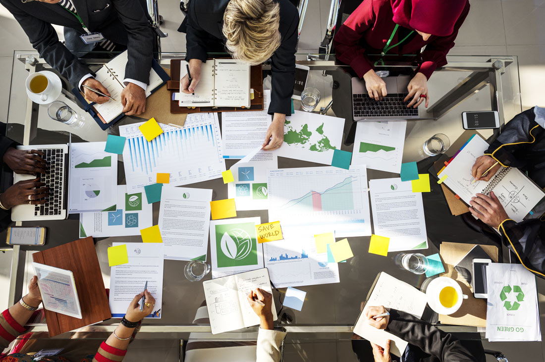An aerial view of a group of public interest technology professionals working together on a project.
